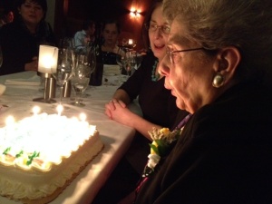 Mama blowing out her candles with sister Frances behind her.